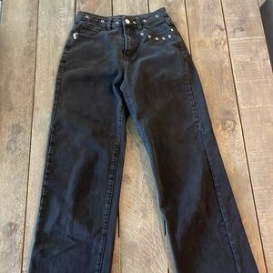 Plain black jeans with ringlet front waist and pocket detailing